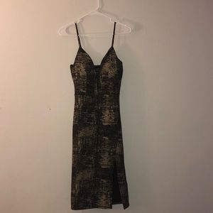 gold and black slit dress